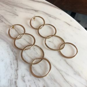 Gold dangling hoop earrings